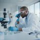 Medical,Development,Laboratory:,Portrait,Of,Black,Male,Scientist,Looking,Under Medical,Development,Laboratory:,Portrait,Of,Black,Male,Scientist,Looking,Under